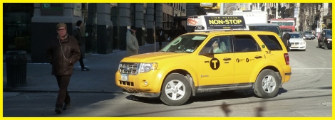 Taxi cabs turning onto New York’s Fifth Avenue at 14th Street.